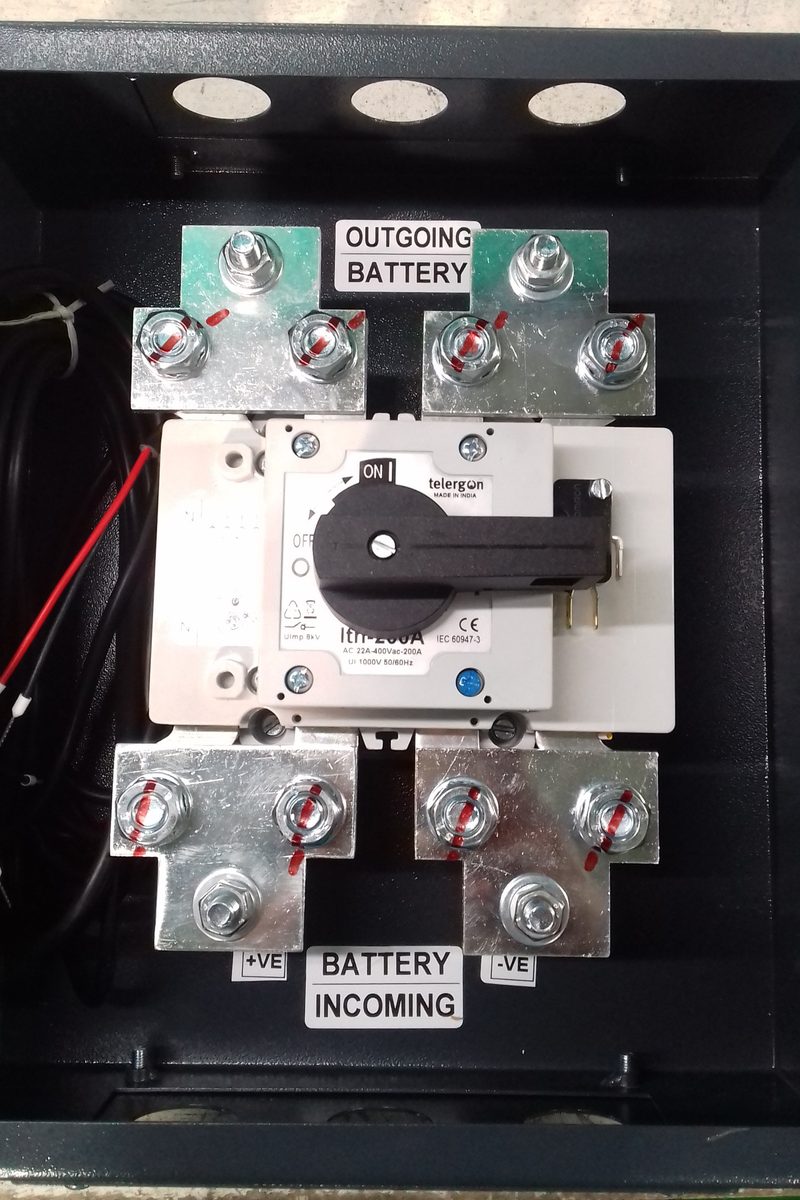 Battery switch box with isolator switch and busbar terminals, marked battery incoming and outgoing