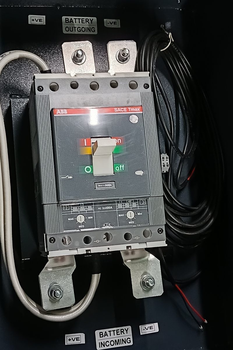 MCCB box with moulded-case circuit breaker and marked battery incoming and outgoing terminals